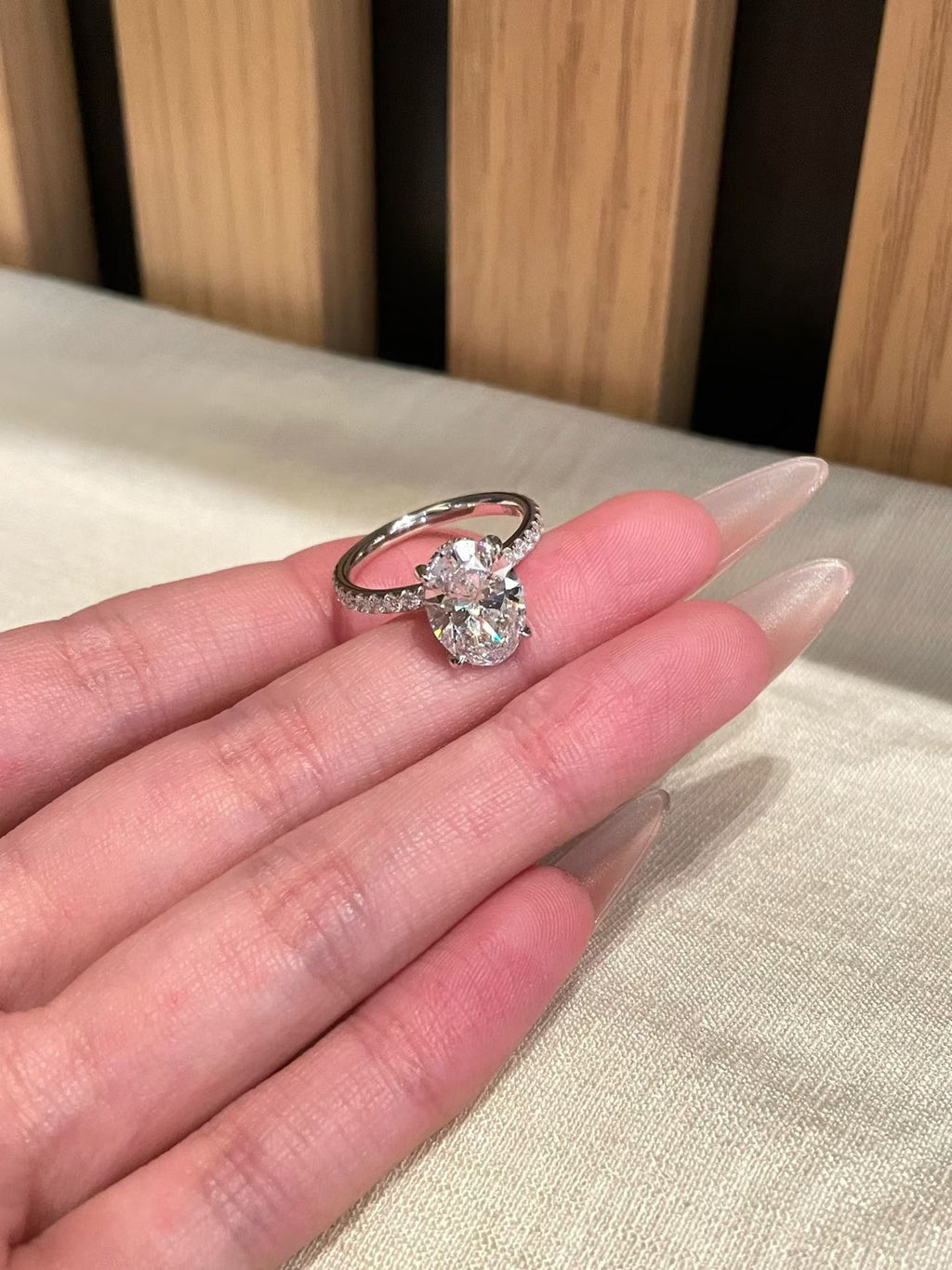 3 ct oval lab-grown diamond four-prong ring with pavé band, view 4