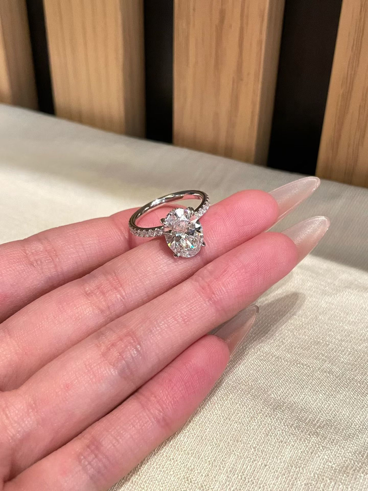 3 ct oval lab-grown diamond four-prong ring with pavé band, view 4