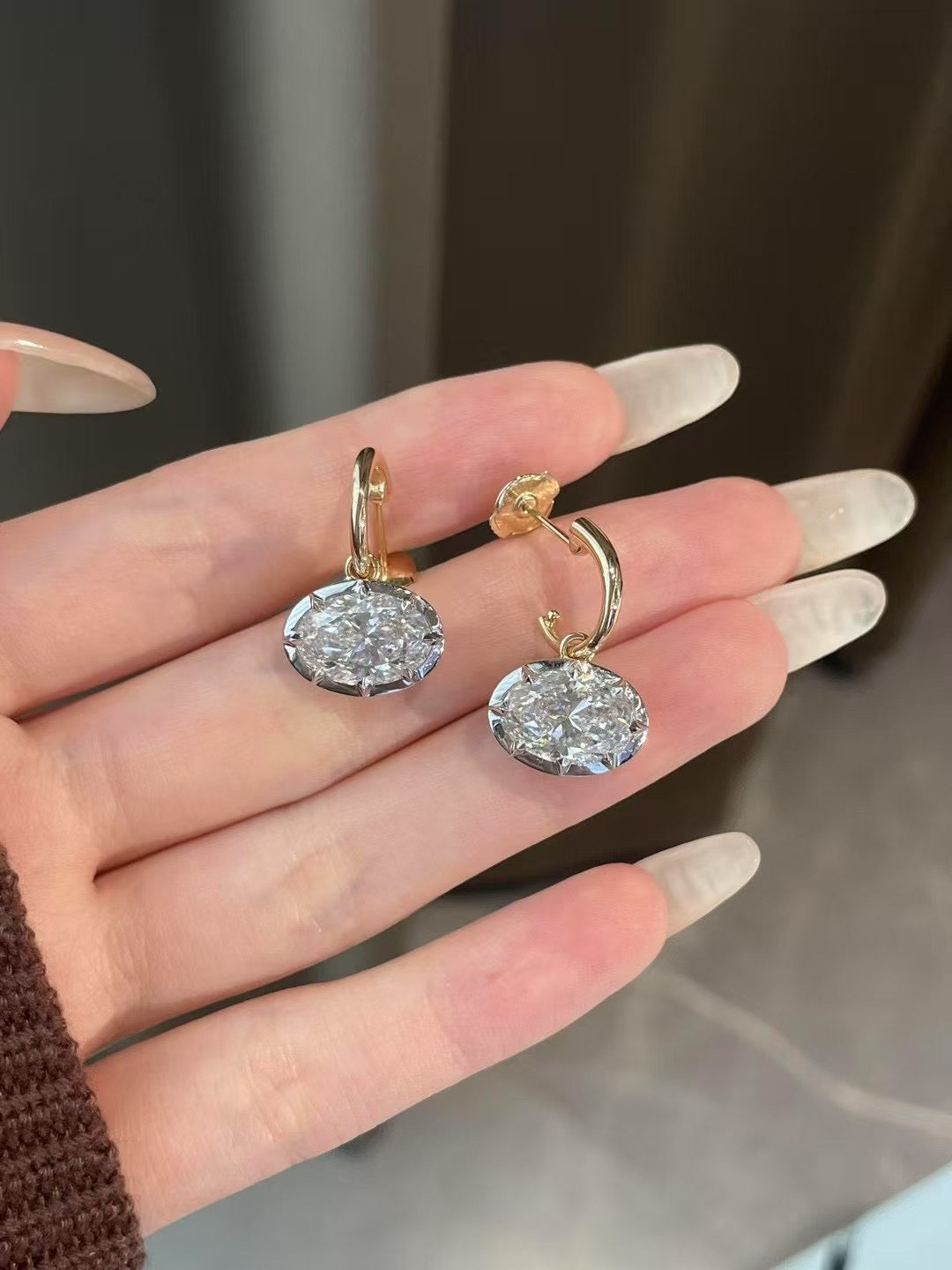 Georgian-inspired oval lab-grown diamond earrings with contrasting dark settings and yellow gold details