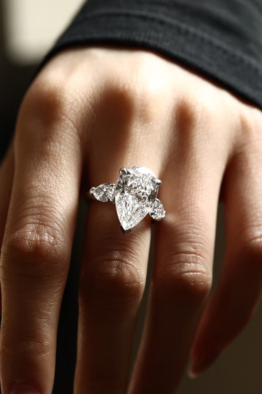 6 carat pear-cut lab-grown diamond three-stone ring in platinum