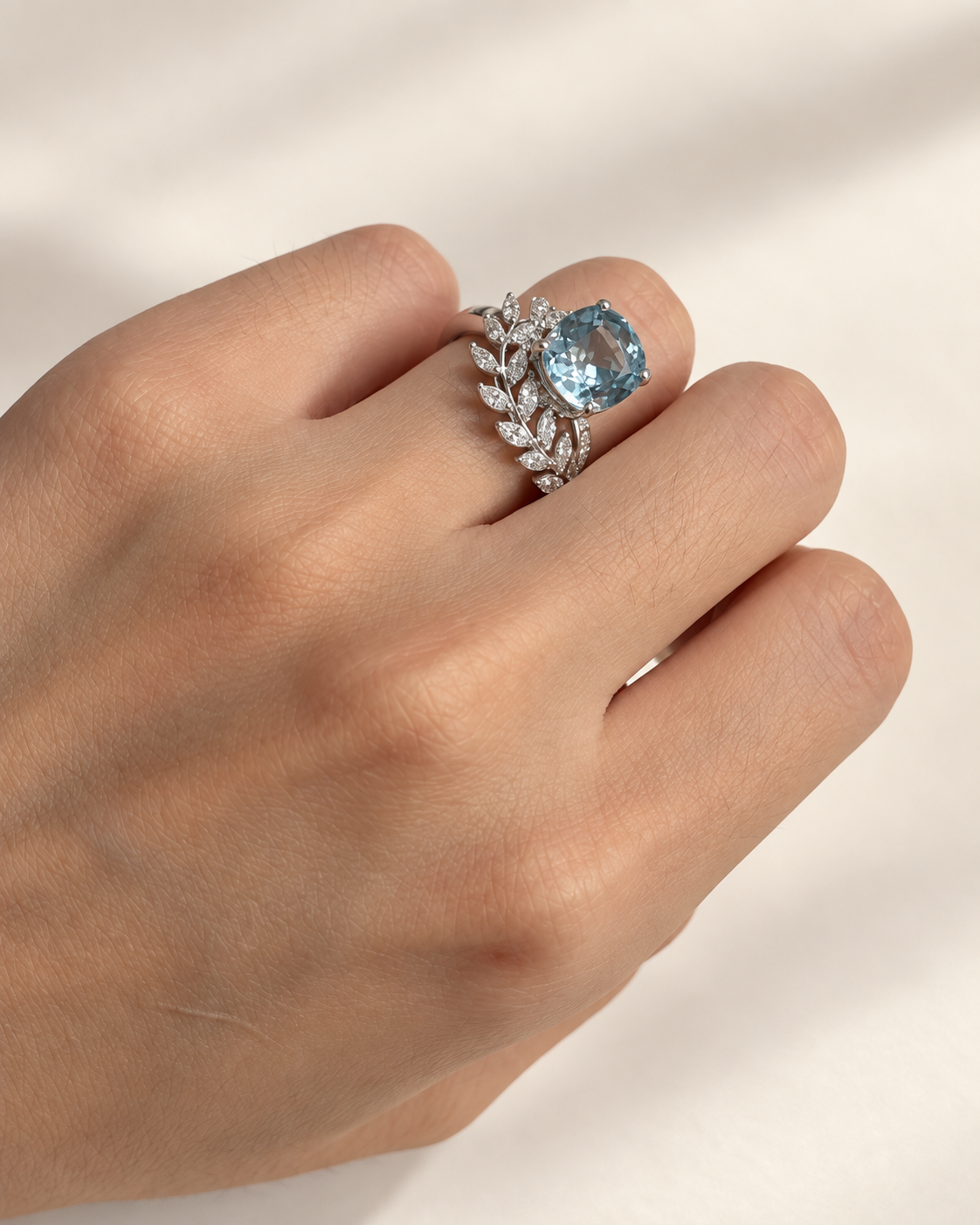Oval aquamarine ring with lab-grown diamond vine accents in white gold