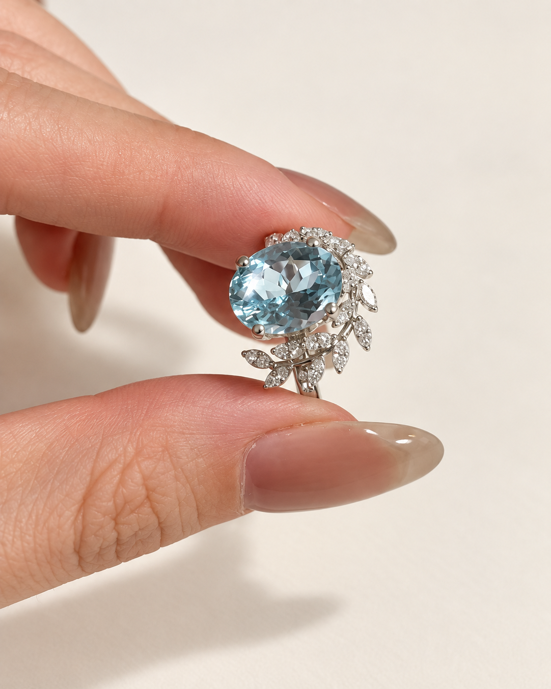 Oval aquamarine ring with lab-grown diamond vine accents in white gold
