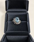 Oval aquamarine ring with lab-grown diamond vine accents in white gold