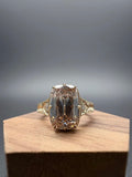 Front view of champagne elongated cushion lab-grown diamond ring in yellow gold