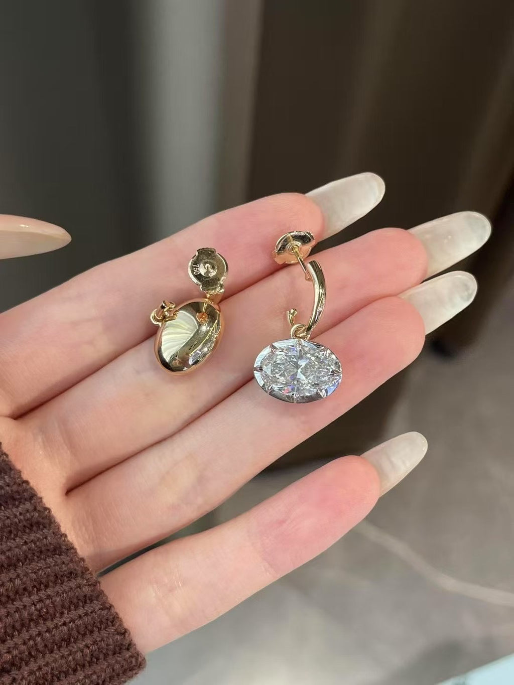 Georgian-inspired oval lab-grown diamond earrings with contrasting dark settings and yellow gold details