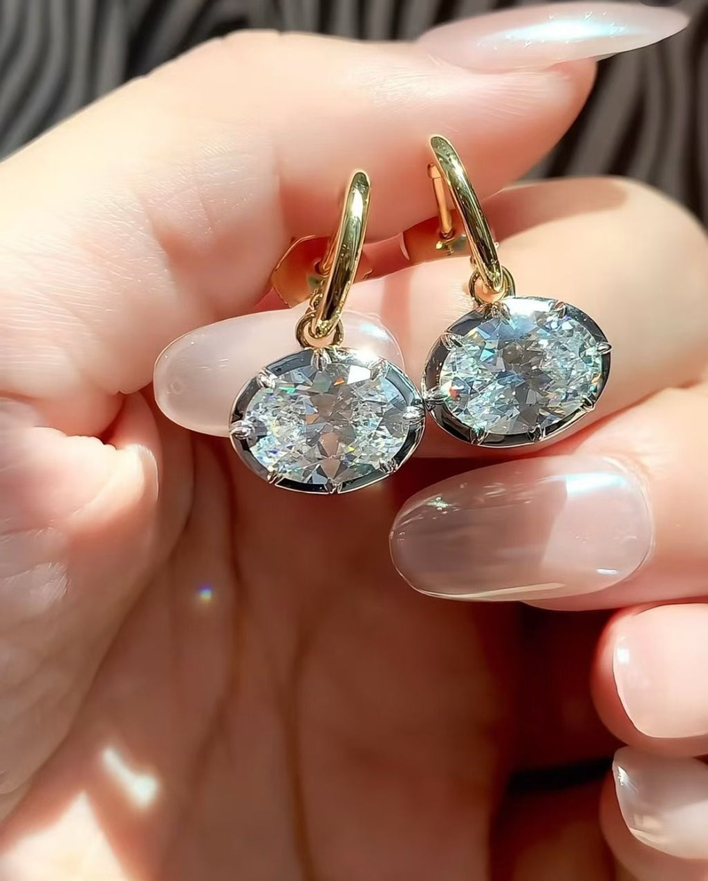 Georgian-inspired oval lab-grown diamond earrings with contrasting dark settings and yellow gold details
