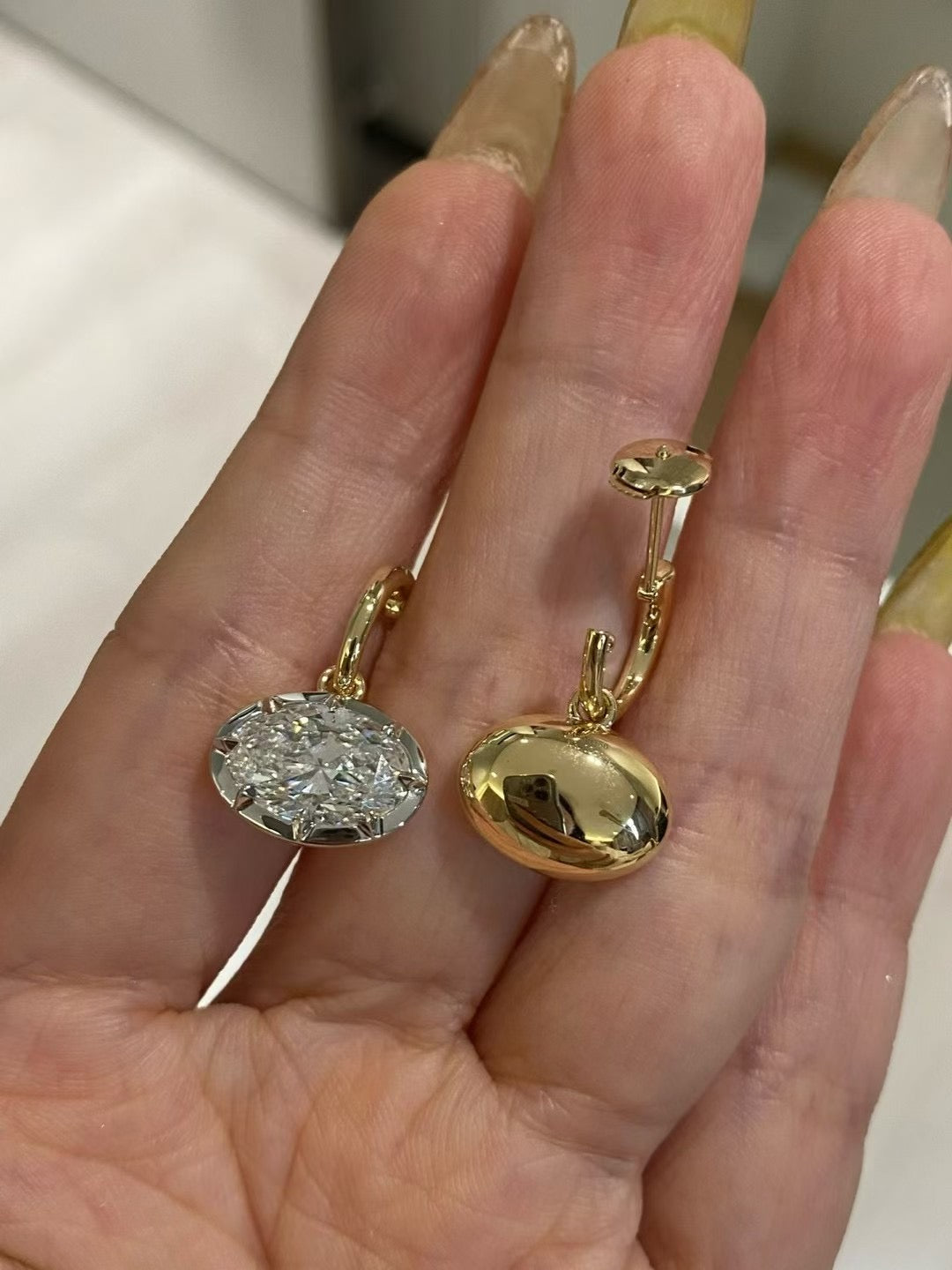Front and back views of oval lab-grown diamond earrings in 18K gold