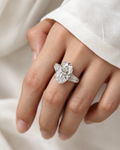 AI-enhanced styling image of oval center trilogy ring with tapered baguette side stones, view 1