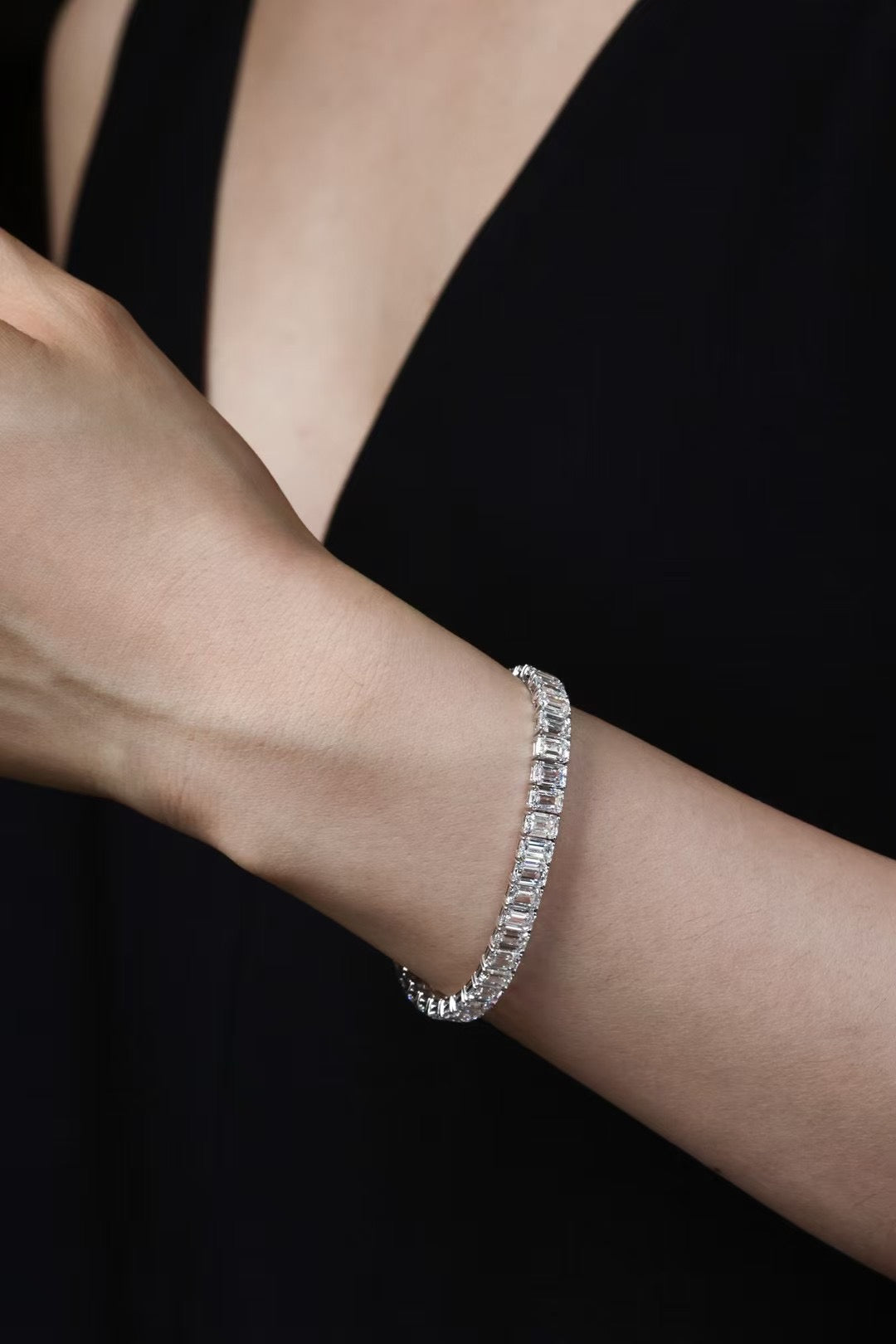 Emerald-cut lab-grown diamond tennis bracelet worn on wrist, view 2