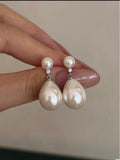 Freshwater pearl drop earrings with natural diamonds and 14K gold posts