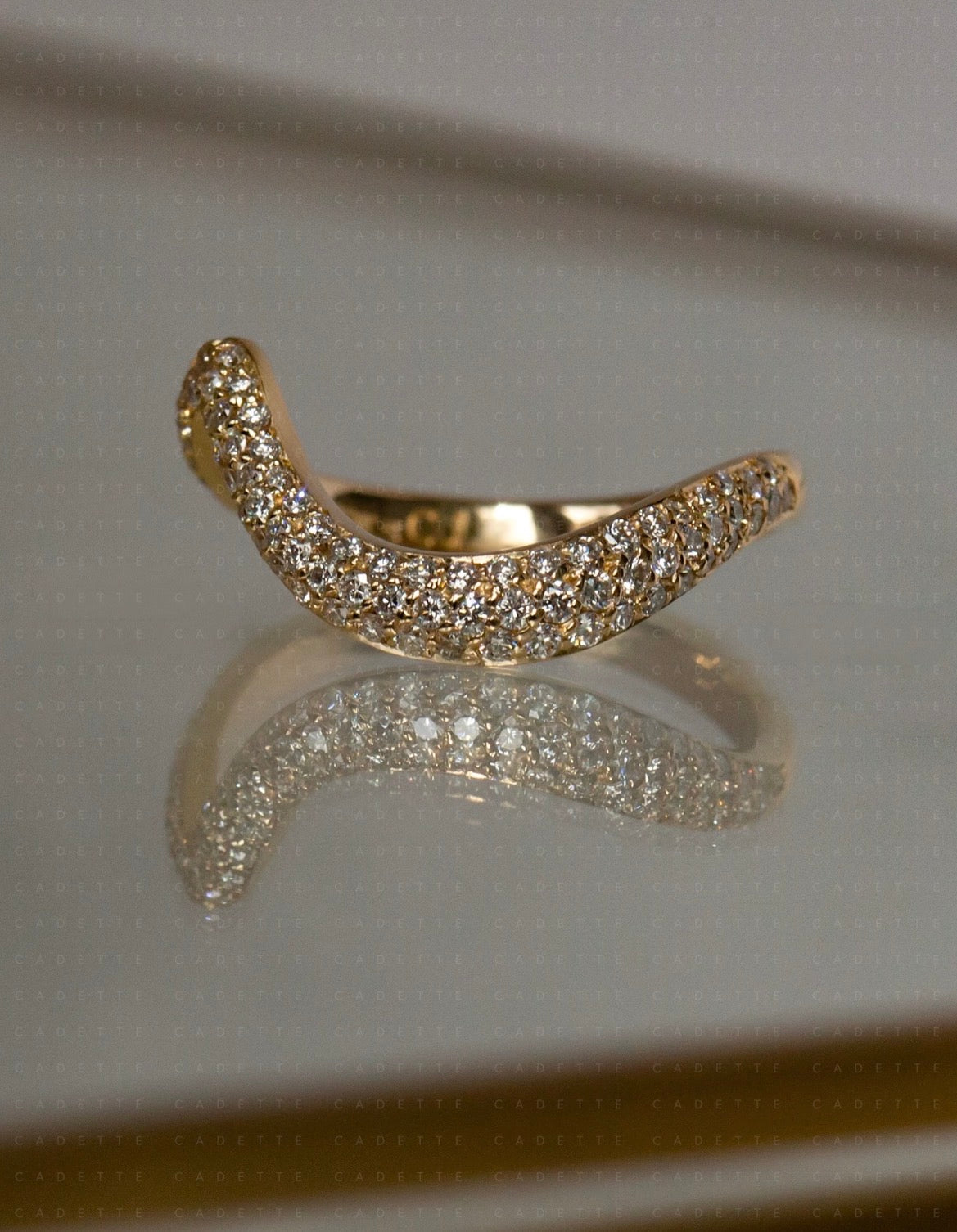 18K yellow gold V-shaped pavé natural diamond stacking band; other rings shown for styling only