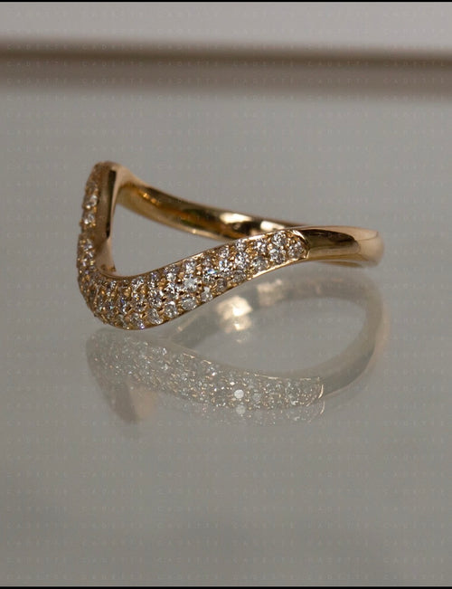 18K yellow gold V-shaped pavé natural diamond stacking band; other rings shown for styling only