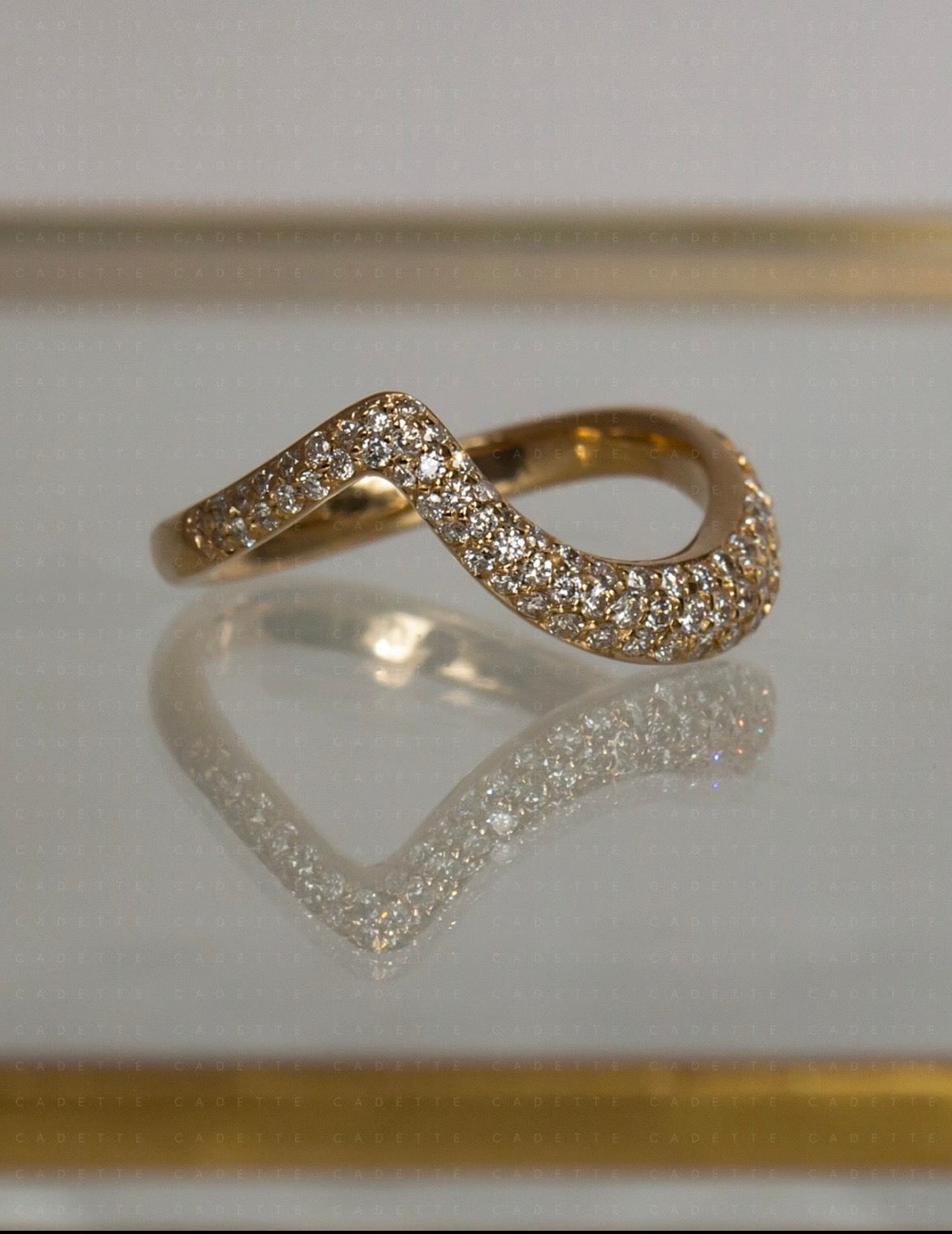 18K yellow gold V-shaped pavé natural diamond stacking band; other rings shown for styling only