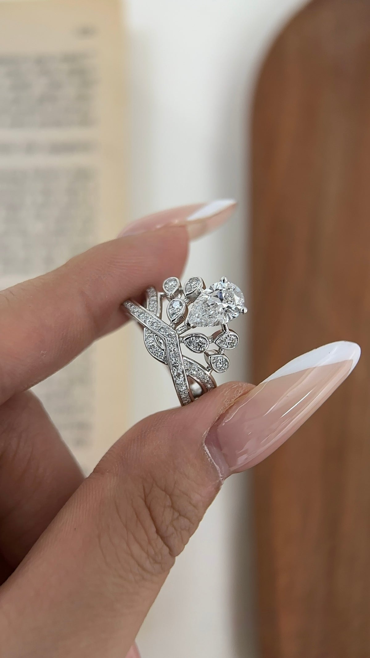 Pear-cut lab-grown diamond ring with pavé crossover bands and teardrop accents