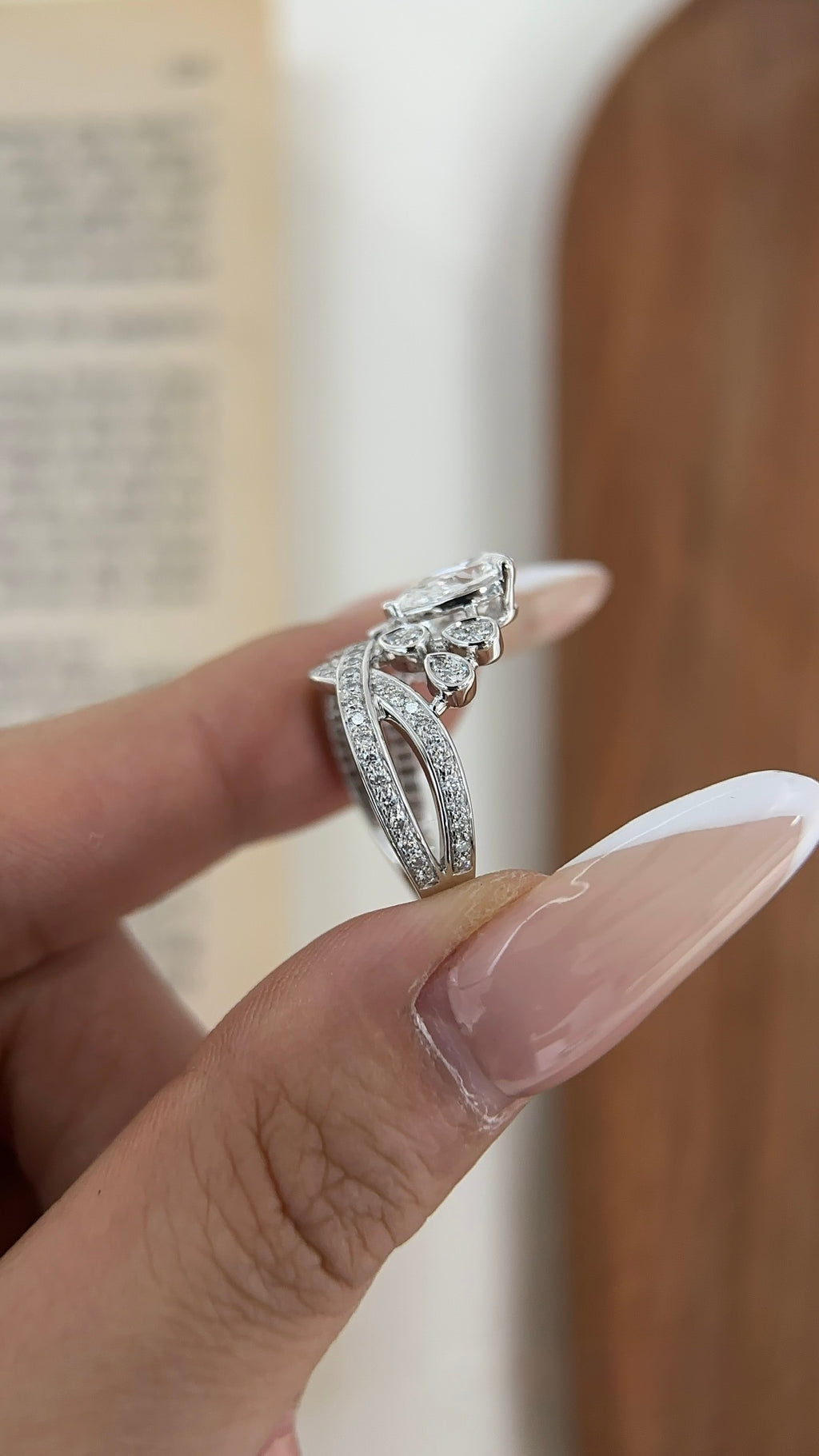 Pear-cut lab-grown diamond ring with pavé crossover bands and teardrop accents