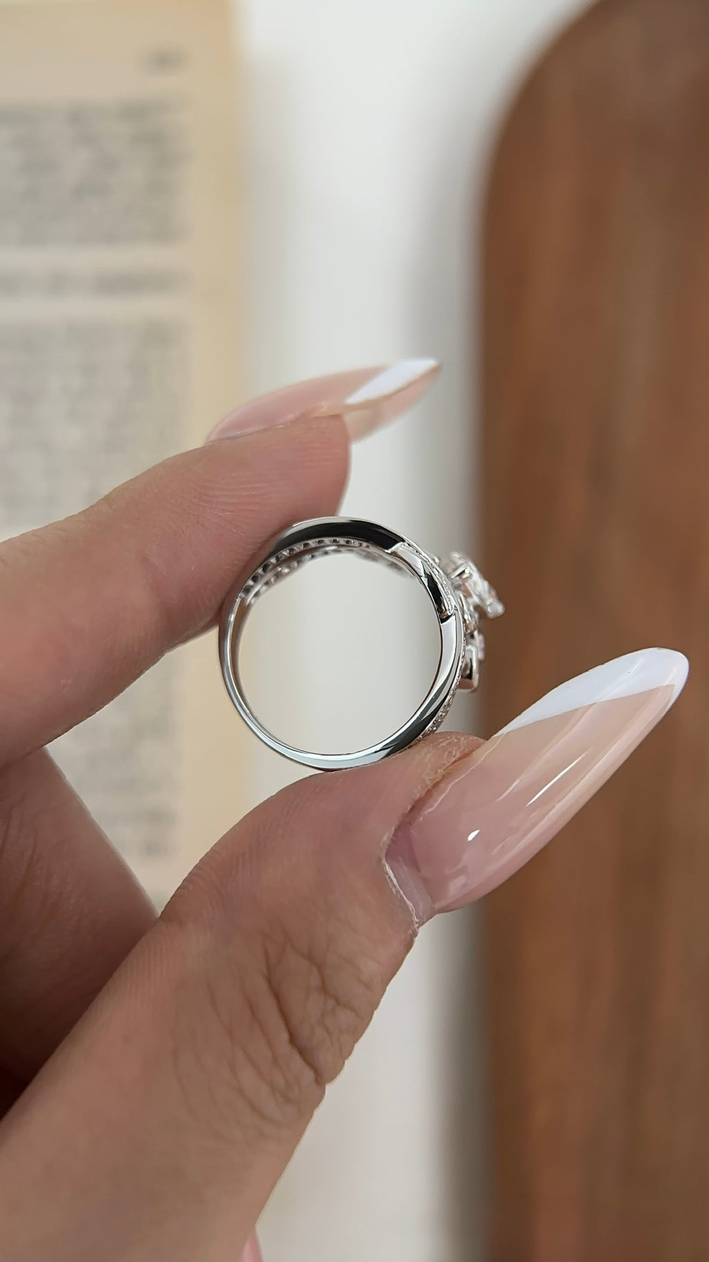 Pear-cut lab-grown diamond ring with pavé crossover bands and teardrop accents