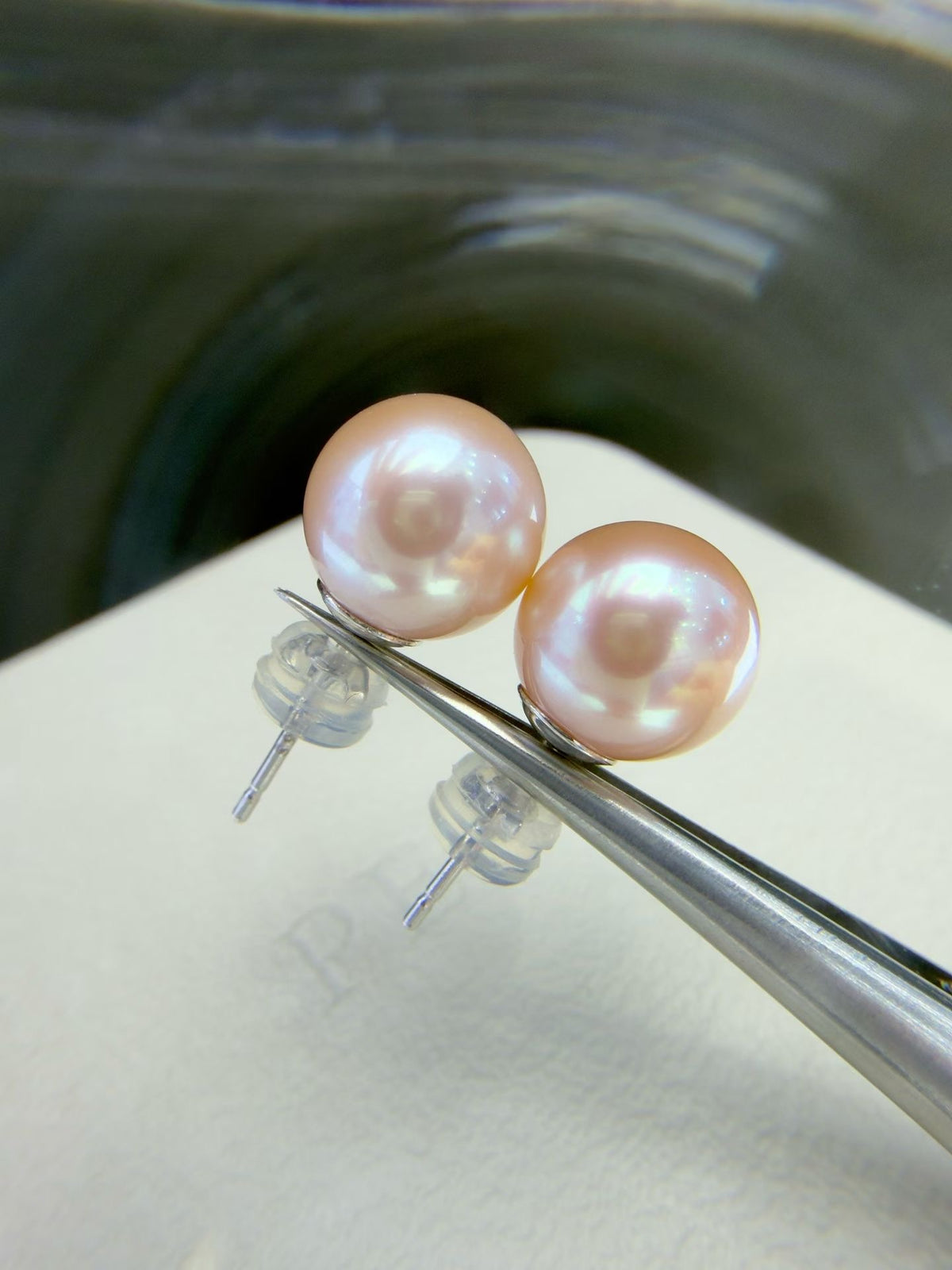 9.5–10mm pink-lavender round freshwater pearl stud earrings with 14K gold posts