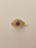 Unheated purple sapphire signet ring in brushed 18K yellow gold with natural diamond halo