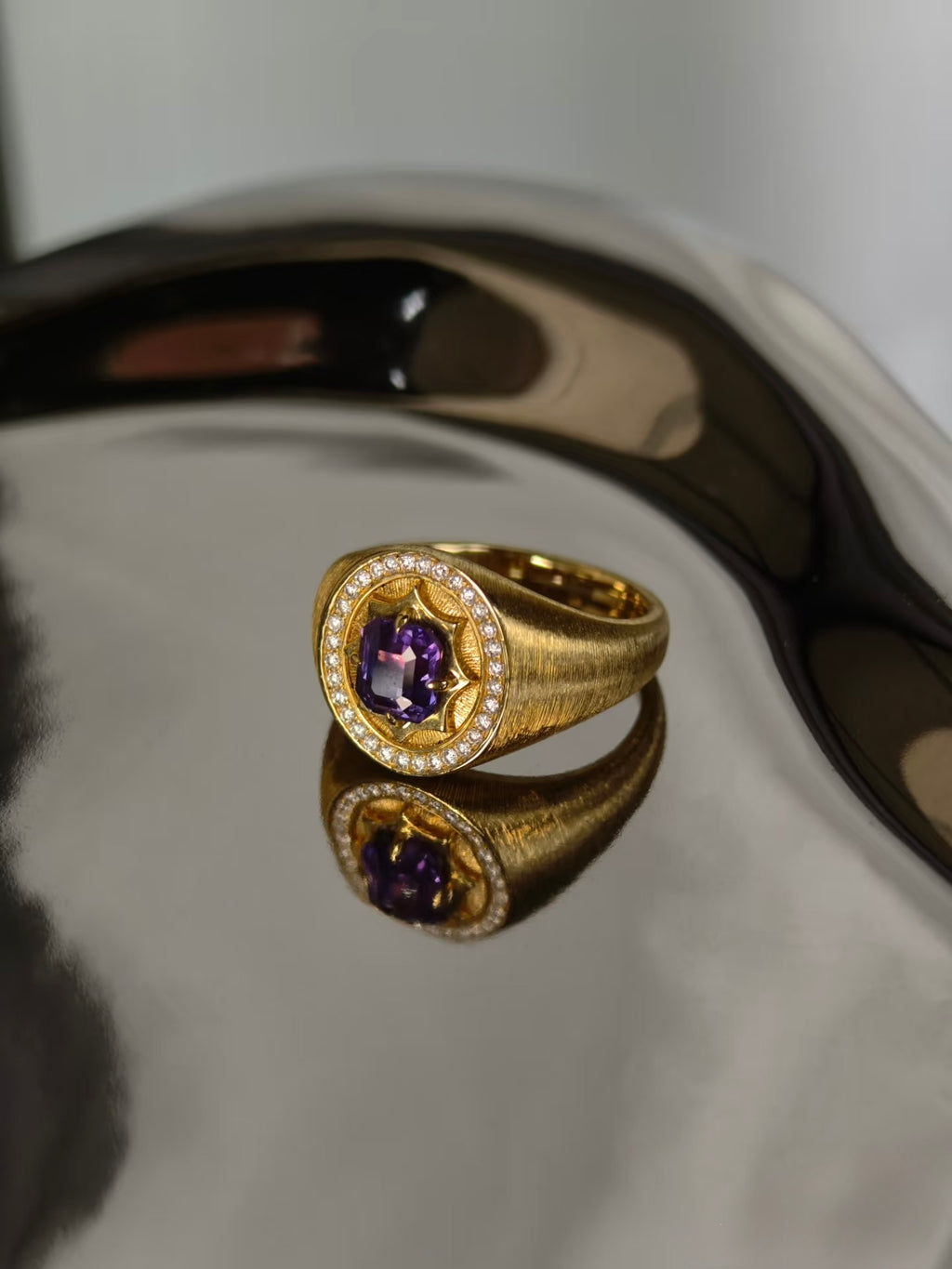 Unheated purple sapphire signet ring in brushed 18K yellow gold with natural diamond halo