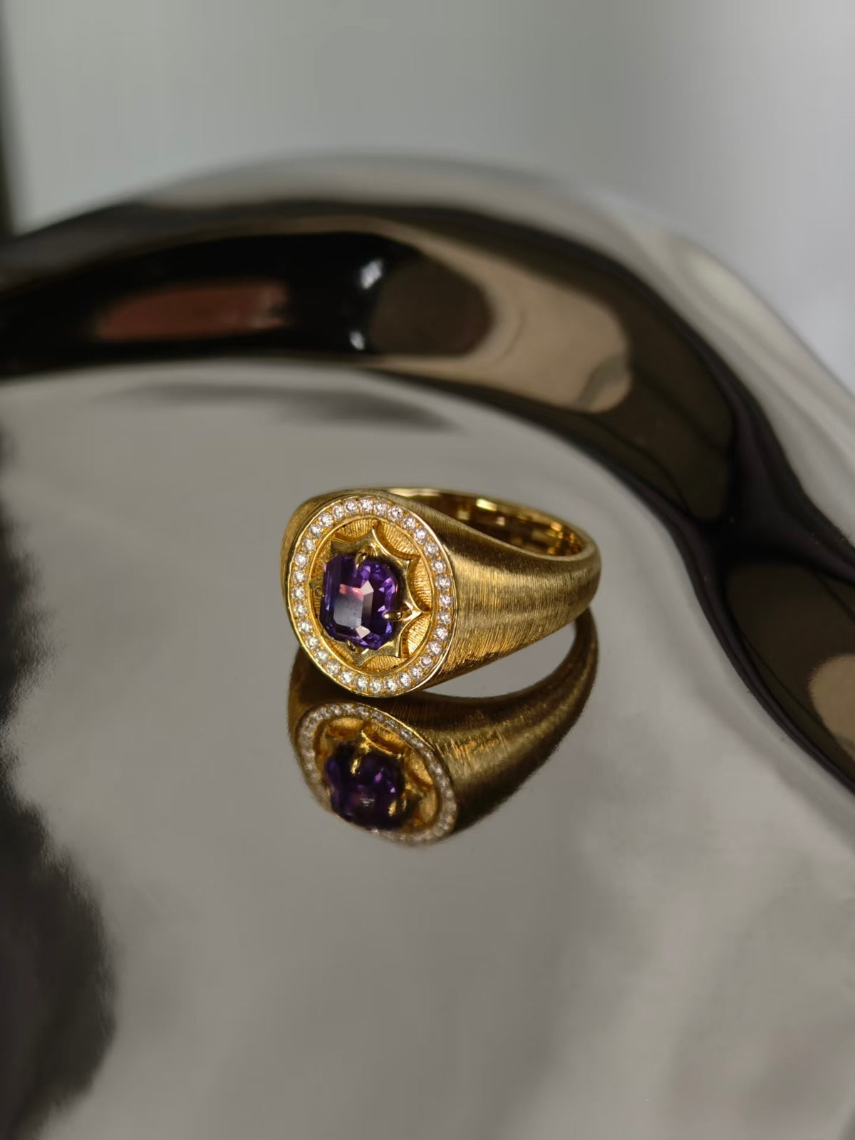 Unheated purple sapphire signet ring in brushed 18K yellow gold with natural diamond halo