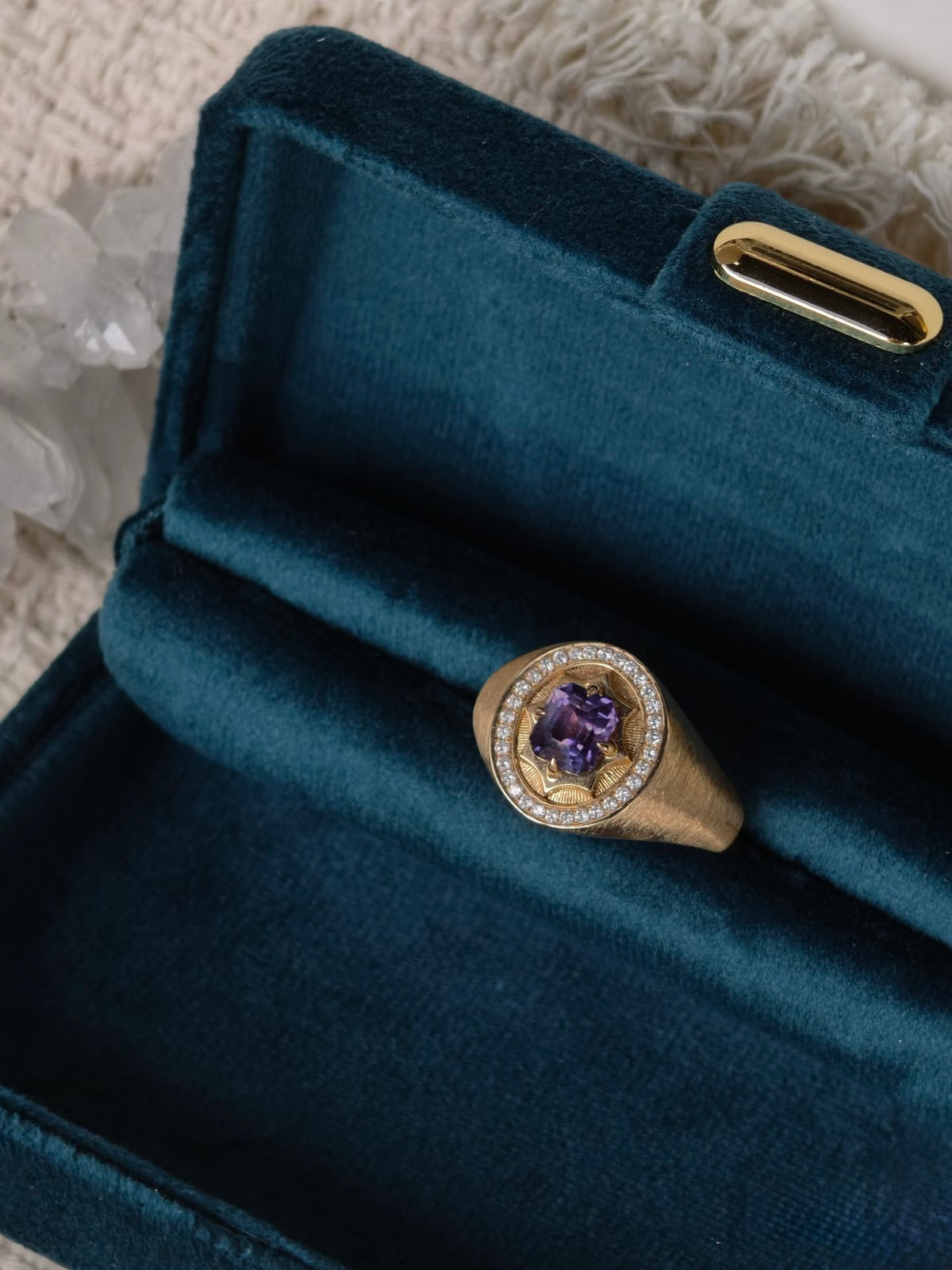 Unheated purple sapphire signet ring in brushed 18K yellow gold with natural diamond halo