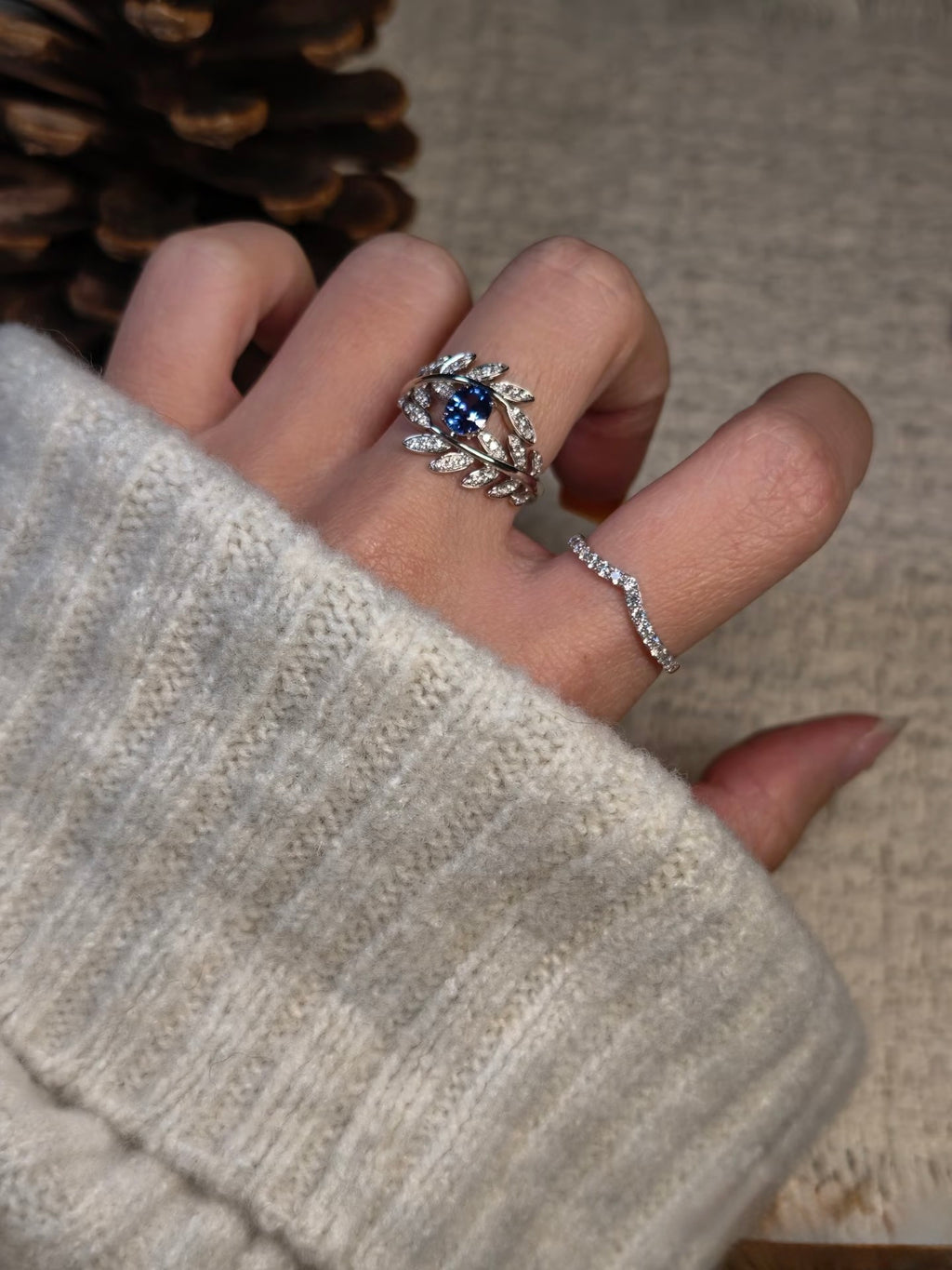 Sapphire leaf ring shown worn; other ring pictured is not included