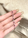 Ruby and natural diamond halo bracelet in 18K rose gold